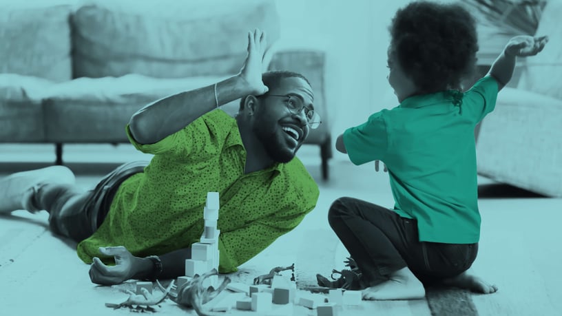 Fast Company Executive Board human-centric workplace company executive plays with child