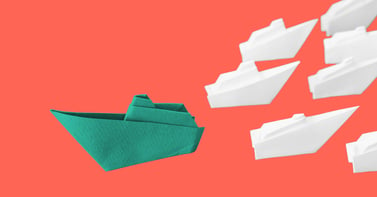 Disruptive leadership - Paper boats sail in opposite directions - Fast Company Executive Board